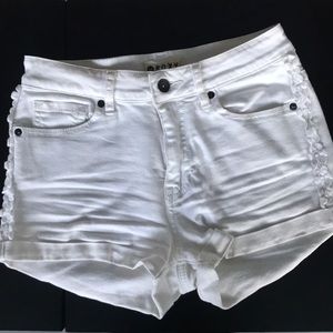 White shorts with flower embellishments